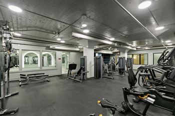 Fitness center with cardio and strength training equipment 1